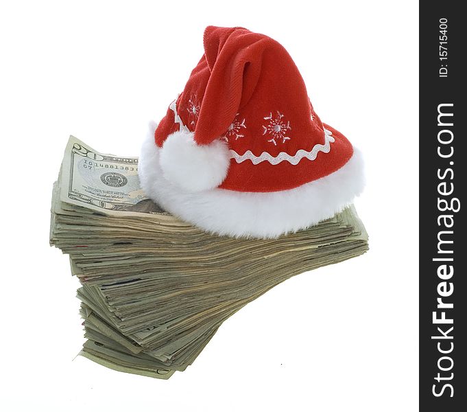 US Currency Twenty Dollar Bills with a red santa hat. isolated on white background. US Currency Twenty Dollar Bills with a red santa hat. isolated on white background.