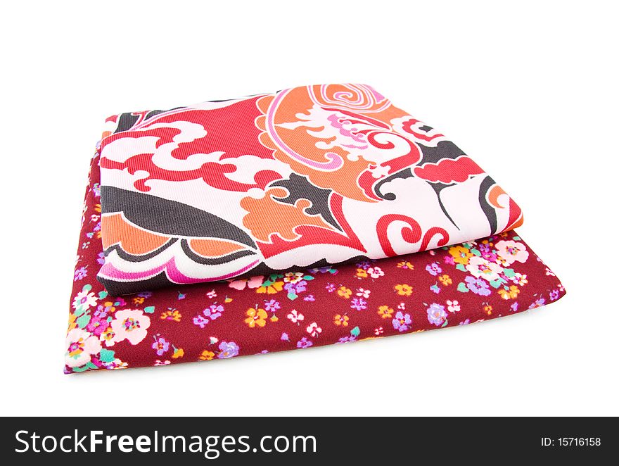Retro polyester textiles with floral patterns in red. Isolated over white background. Retro polyester textiles with floral patterns in red. Isolated over white background.