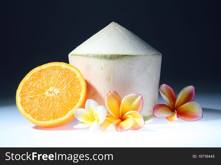 Young coconut and orange with lan thom flowers. Young coconut and orange with lan thom flowers