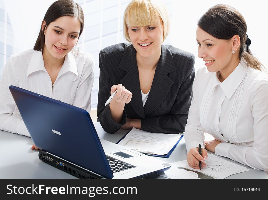 Business women discussing in a meeting. Business women discussing in a meeting