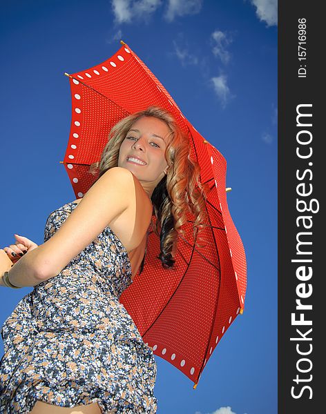 Teenager with  red umbrella