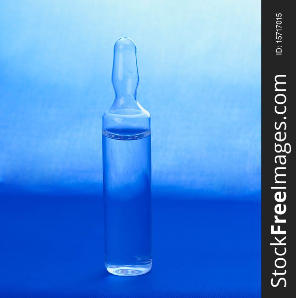 Ampoule on a blue background