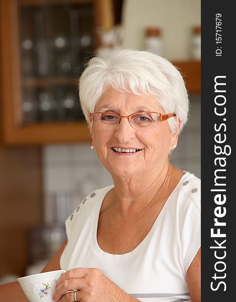 Closeup of senior woman with coffee cup. Closeup of senior woman with coffee cup