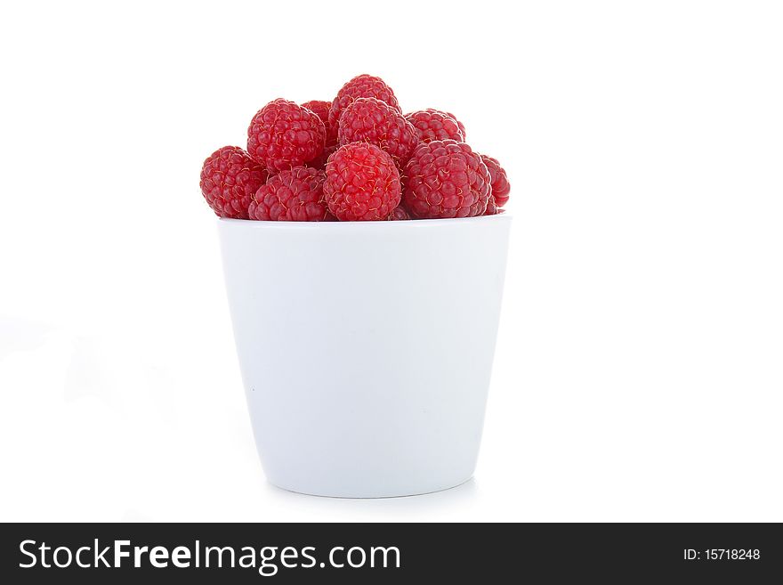 Bowl of raspberry isolated on white