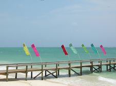 Colorful Flags On A Lonely Pier Royalty Free Stock Photo