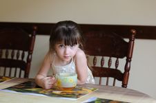 Nice Toddler Girl With Big Cup Of Tea Stock Photography