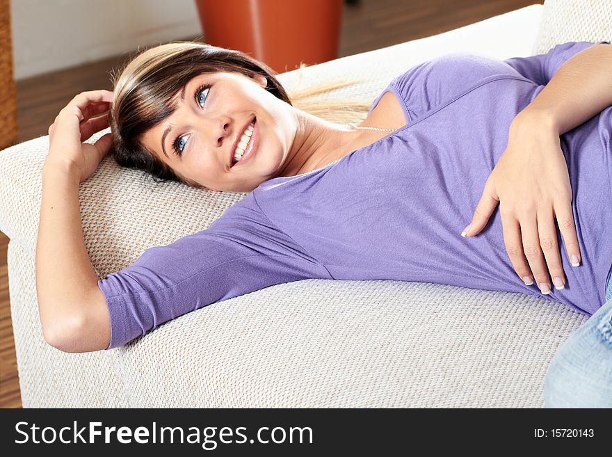 Woman In Living Room Is Smiling