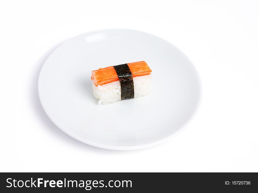 Japanese sushi with Kani and Seaweed on white background. Japanese sushi with Kani and Seaweed on white background
