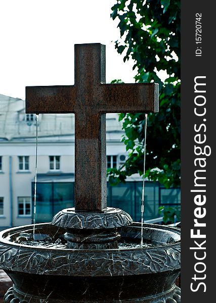 Religious chrisscross like a fountain in church yard