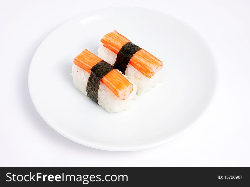 Japanese sushi with Kani and Seaweed on white background. Japanese sushi with Kani and Seaweed on white background