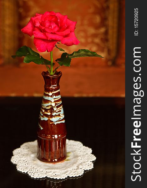 Rose in ceramic vase decorated on hotel lobby