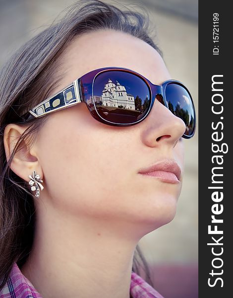 Young woman wearing the big modern sunglasses. Young woman wearing the big modern sunglasses.