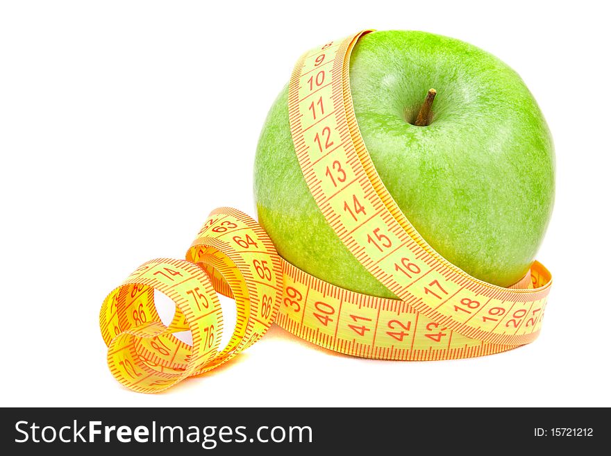 Green apple and tape measure isolated on white