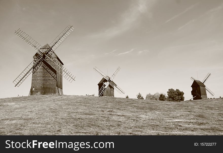 Group of antique trestle type Windmills (from 19th century) in sepia