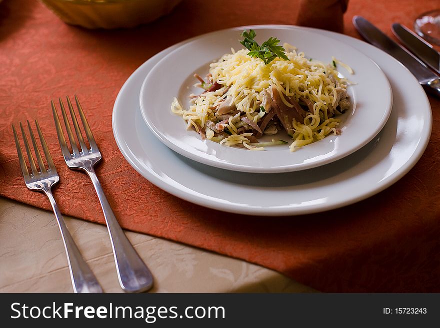 Dish with cheese, greens and meat. Dish with cheese, greens and meat