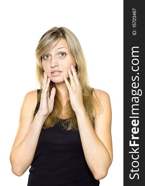 Close-up of a young woman looking surprised on white background