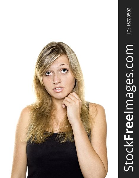 Close-up of a young woman looking surprised on white background