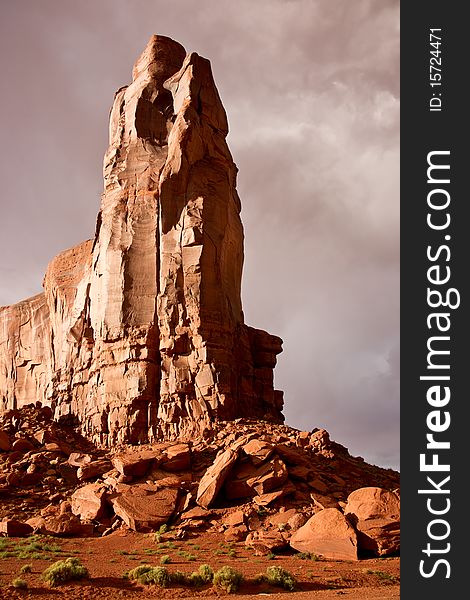 A sandstone spire at sunset in Monument Valley. A sandstone spire at sunset in Monument Valley