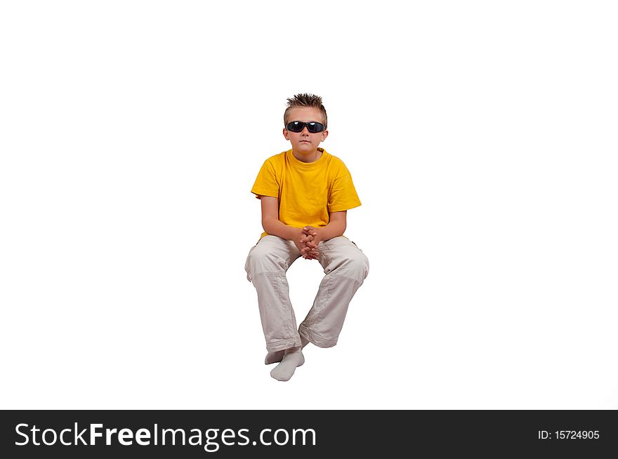 Boy with sunglasses sit in air, isolated on white background