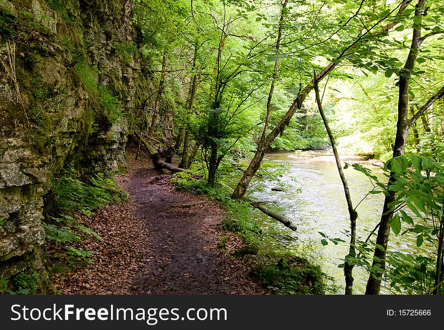 Hiking trail in the Black Forest between rocks and river. Hiking trail in the Black Forest between rocks and river