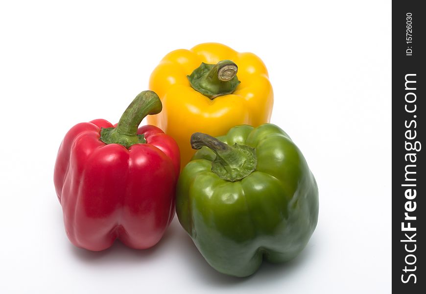 Peppers of different colors isolated on white