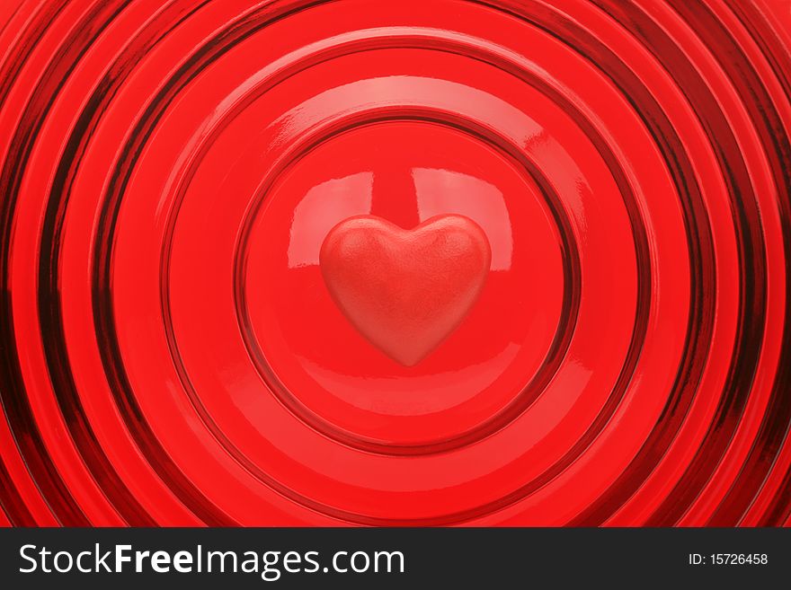 Heart on a red background with concentric circles
