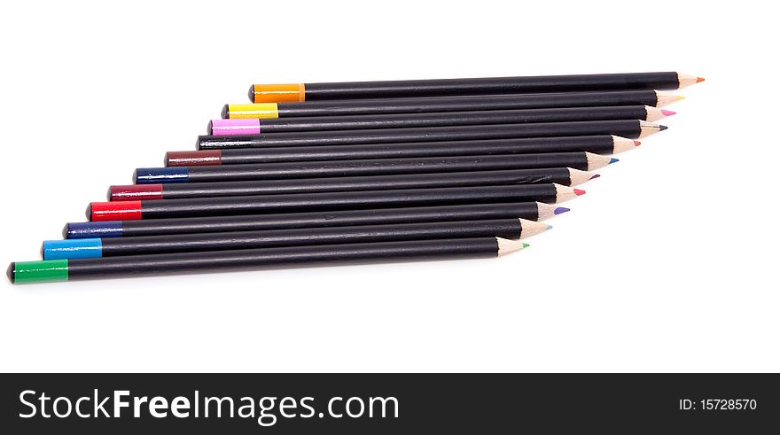 Eleven colorful pencils abreast isolated over white