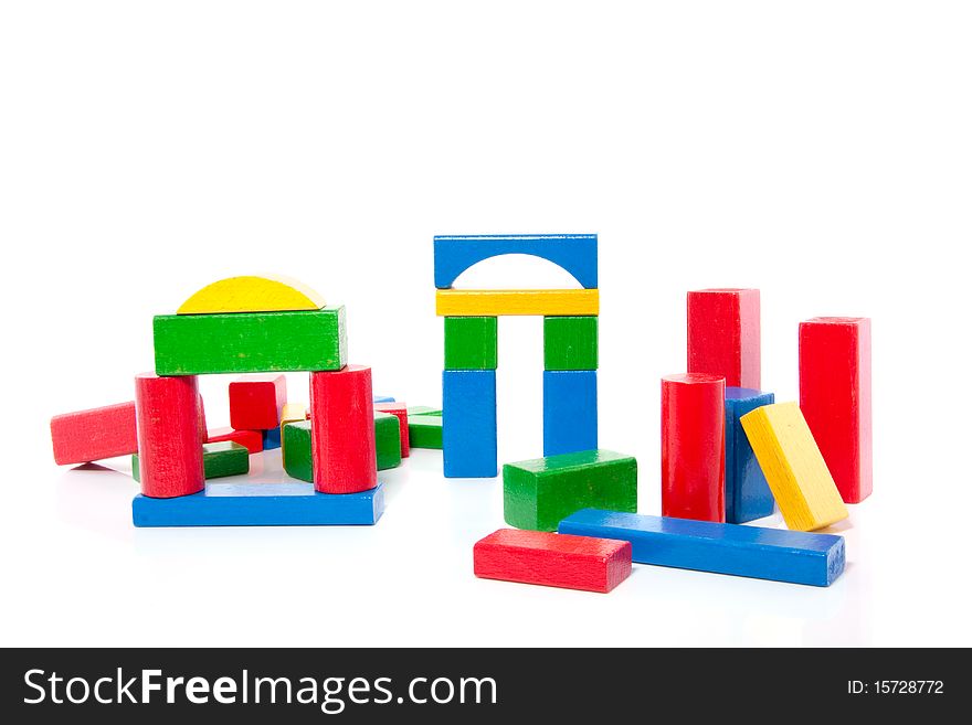 Colorful wooden play blocks isolated over white