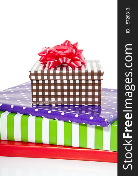 A stack of colorful gifts isolated over white. A stack of colorful gifts isolated over white