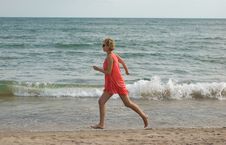 Young Woman Running On The Beach Stock Photos Young Woman Running On The Beach Stock Photos