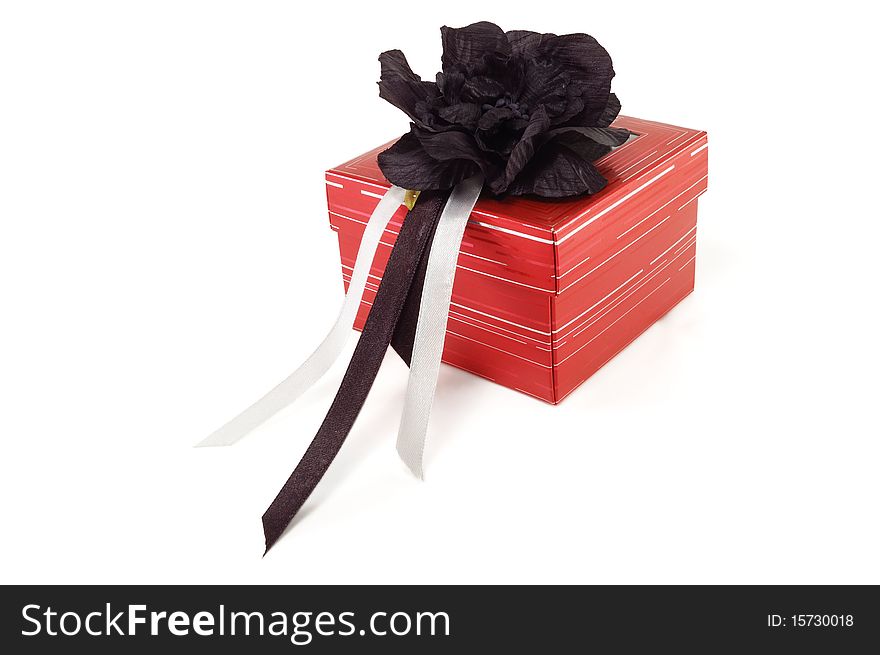 The gift box with tapes is isolated on a white background
