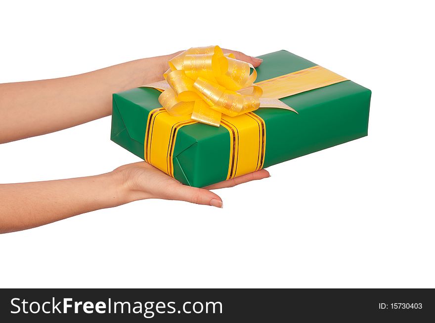 Woman giving a green box with yellow ribbon as a gift