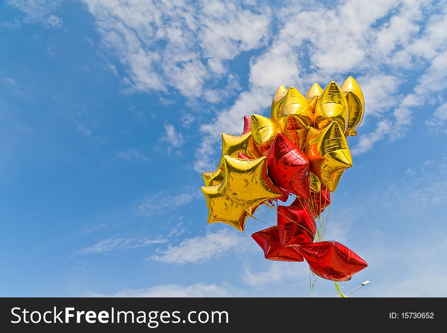 Bunch of colorful balloons in blue sky