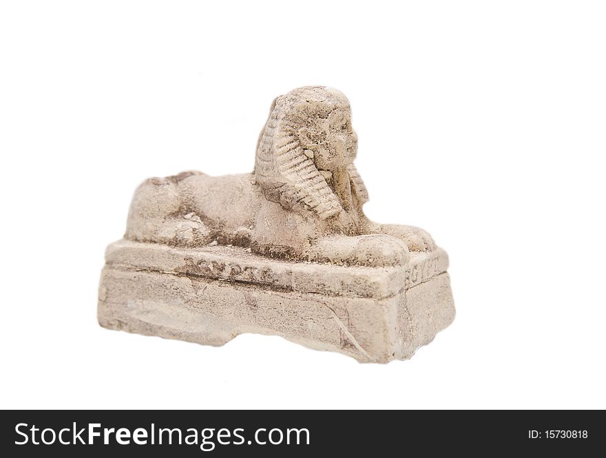 Gypsum statue of a sphinx on a white background