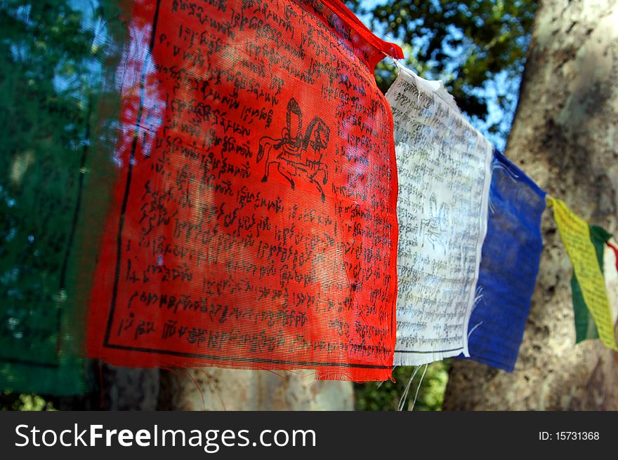 Colorful Tibetian/Buddhist prayer flags hanging outside. Colorful Tibetian/Buddhist prayer flags hanging outside