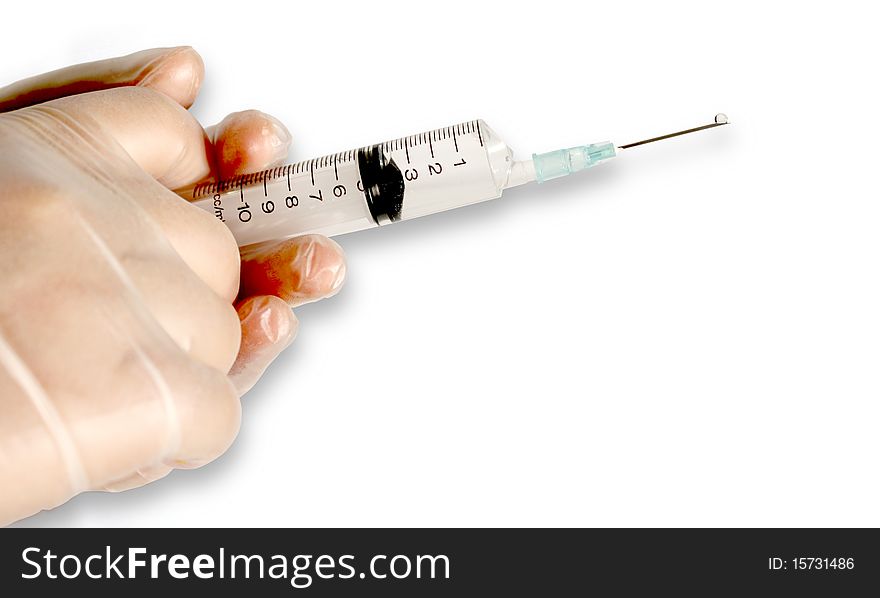 Two gloved hands holding a syringe, ready for injection. Two gloved hands holding a syringe, ready for injection