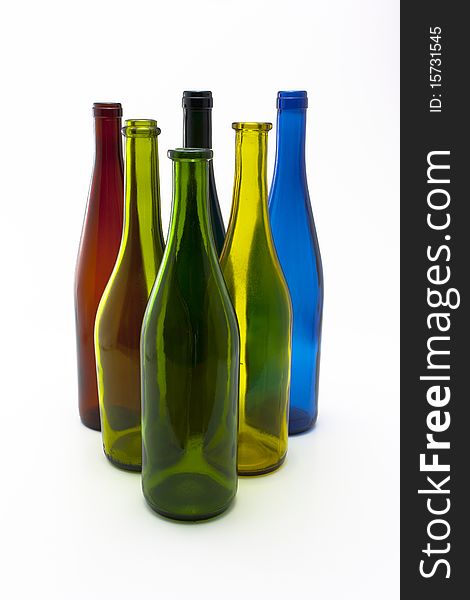 Triangle of six colorful wine bottles