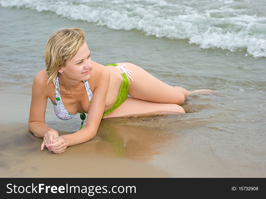 Sitting On The Beach In Water