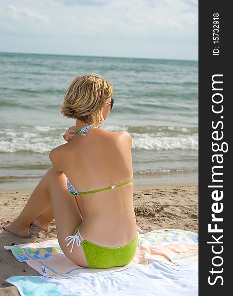 girl sitting on the beach