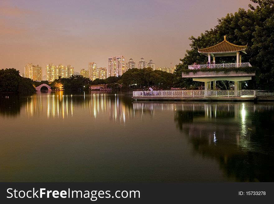 Leeche Park in Shenzhen city by night. Evening landscape with beautiful lake and Chinese pavilion. Leeche Park in Shenzhen city by night. Evening landscape with beautiful lake and Chinese pavilion.