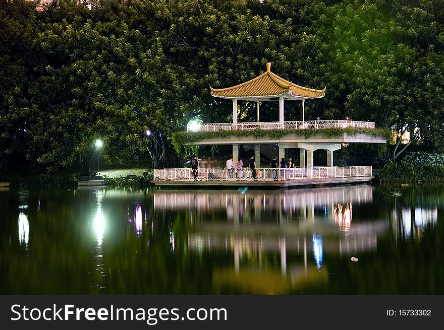 Leeche Park in Shenzhen city by night. Evening landscape with beautiful lake and Chinese pavilion. Leeche Park in Shenzhen city by night. Evening landscape with beautiful lake and Chinese pavilion.