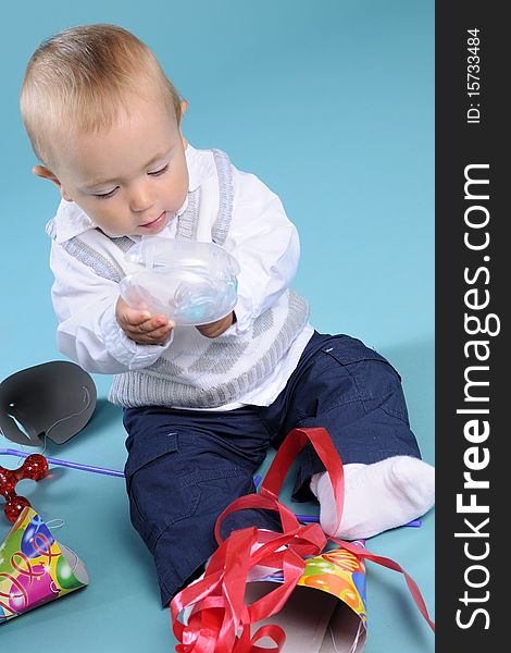 Beautiful caucasian kid playing with toys in studio. Beautiful caucasian kid playing with toys in studio