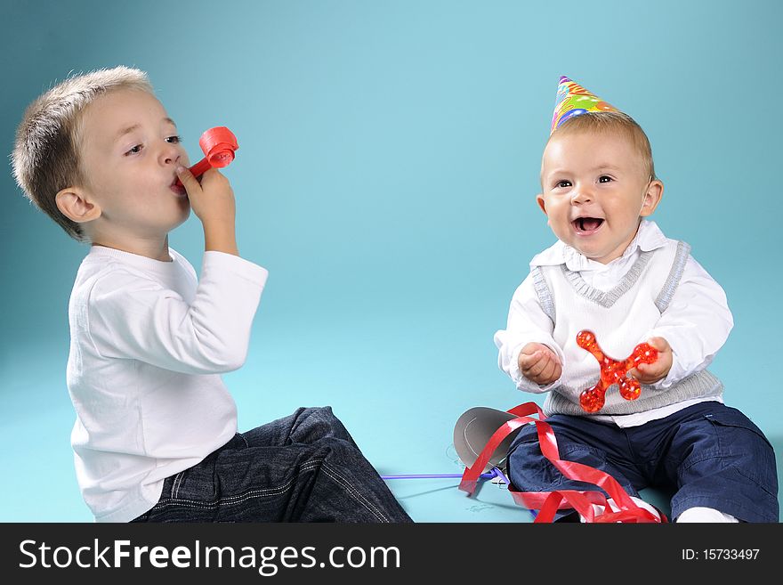 Beautiful caucasian kids playing with toys in studio. Beautiful caucasian kids playing with toys in studio