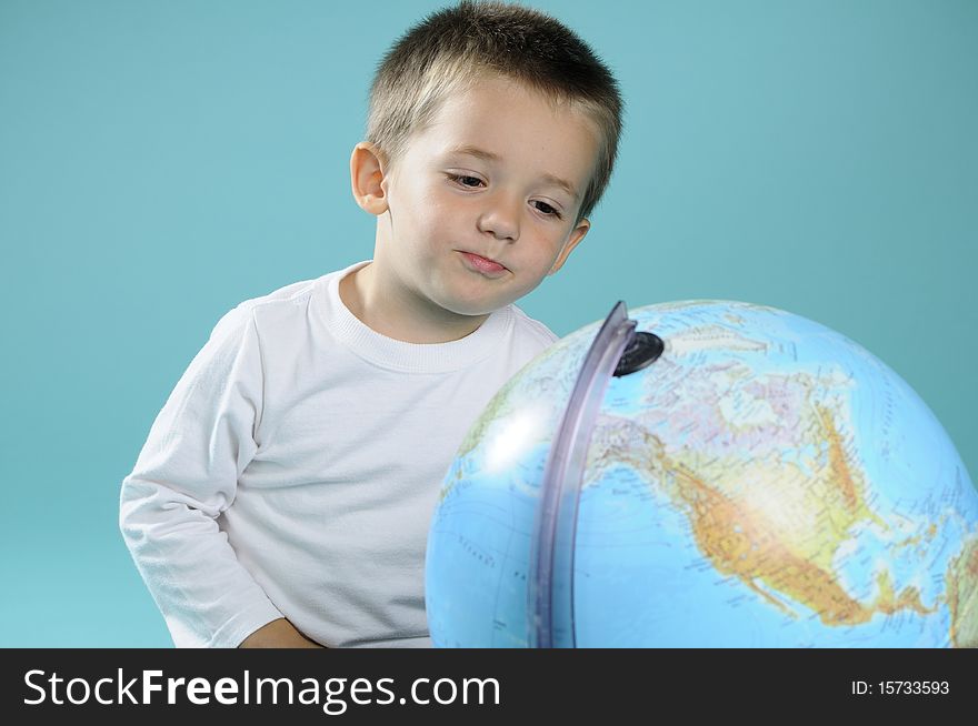 White Boy Learning Geography With Globe