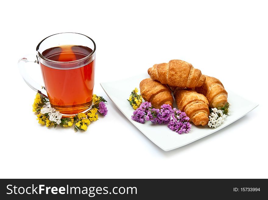 Croissants and hot tea isolated on white background. Croissants and hot tea isolated on white background