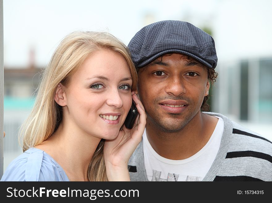 Closeup of young couple with telephone. Closeup of young couple with telephone