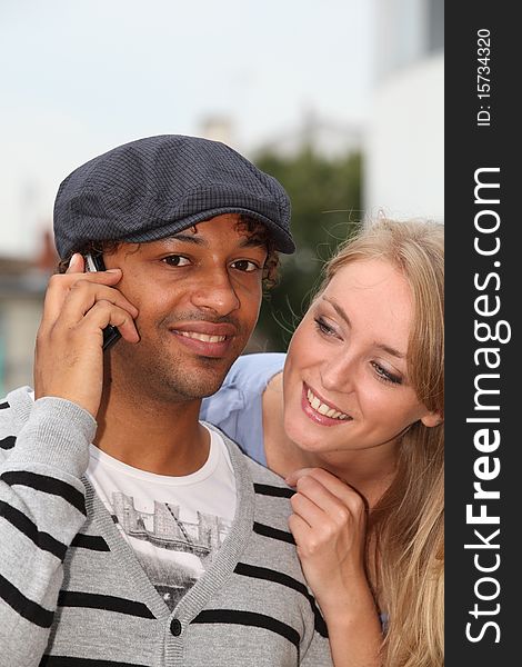 Closeup of young couple with telephone. Closeup of young couple with telephone