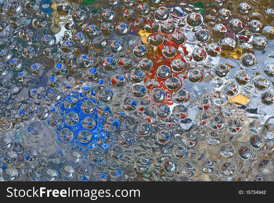 Abstract Colored On Glass Surface Macro.