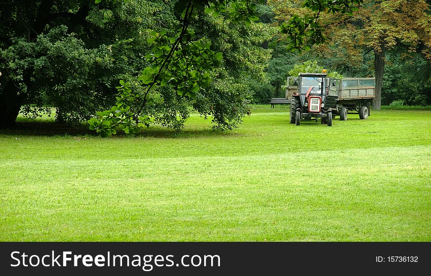 Tractor standing in the park. Tractor standing in the park