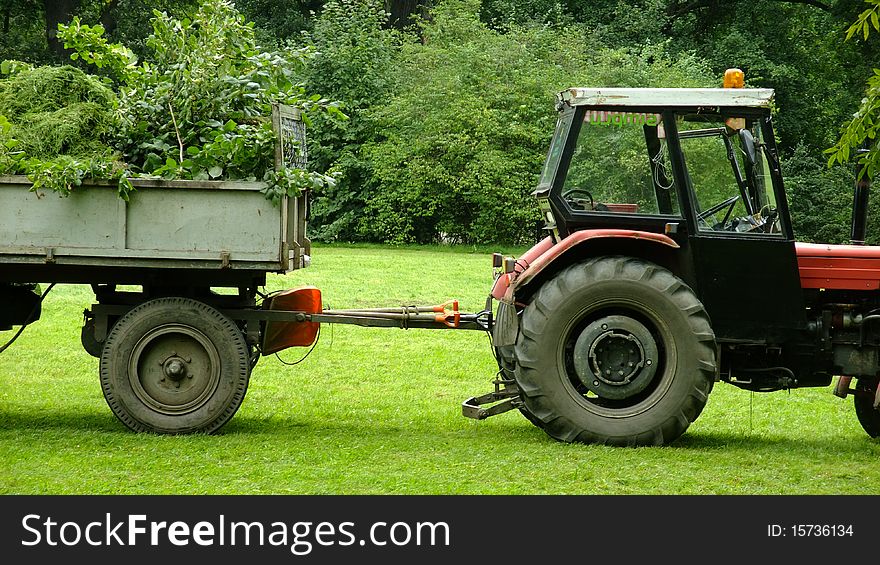 Tractor standing in the park. Tractor standing in the park